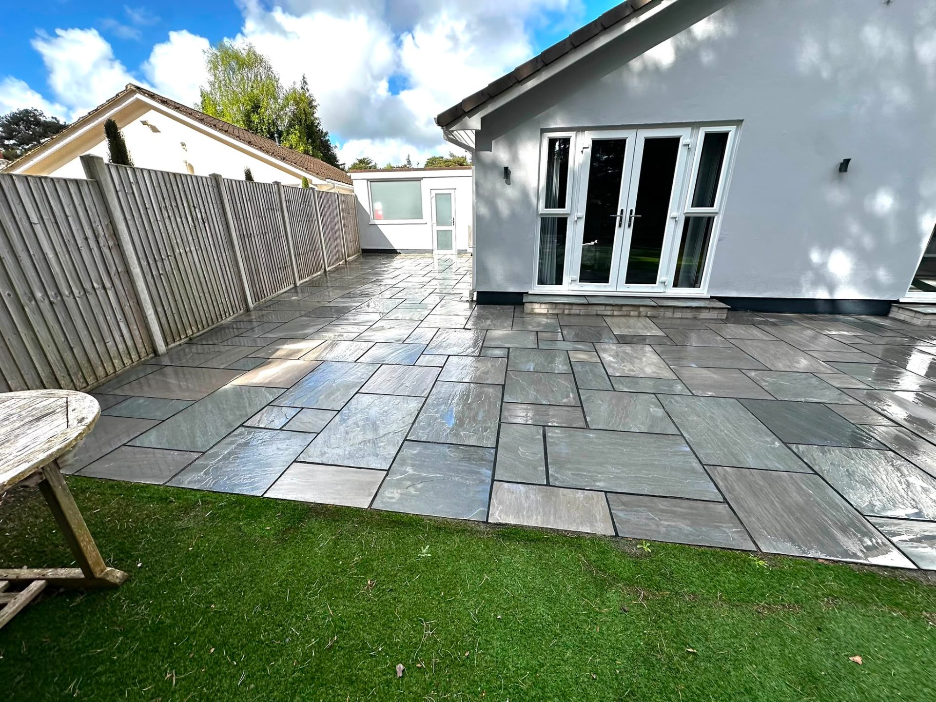 Indian sandstone patio restored to natural grey; Dorset garden by Dorset Exterior Cleaning
